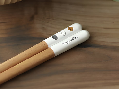 Toy poodle chopsticks