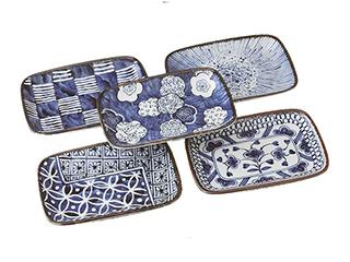 Handcrafted Japanese ceramic plates arranged for a traditional meal.